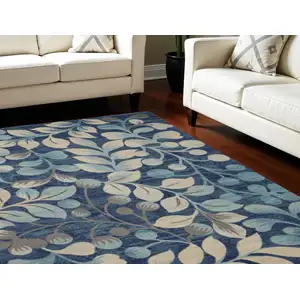 Photo of Navy Blue and Beige Botanical Leaves Area Rug