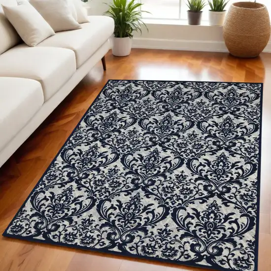 Navy Blue and Ivory Damask Distressed Area Rug Photo 1