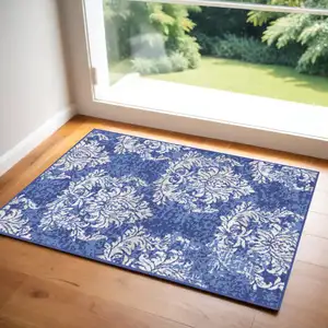 Photo of Navy Blue and Ivory Damask Distressed Area Rug