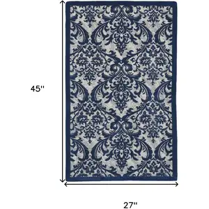 Photo of Navy Blue and Ivory Damask Distressed Area Rug