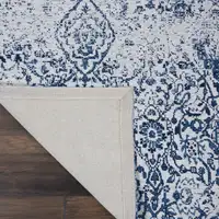 Photo of Navy Blue and Ivory Damask Distressed Area Rug