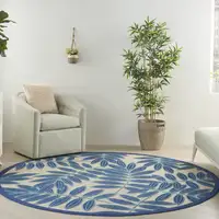 Photo of Navy and Beige Leaves Indoor Outdoor Area Rug