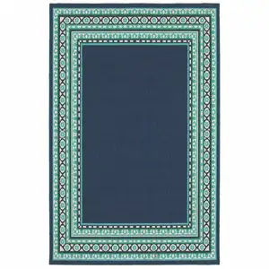 Photo of Navy and Green Geometric Indoor Outdoor Area Rug