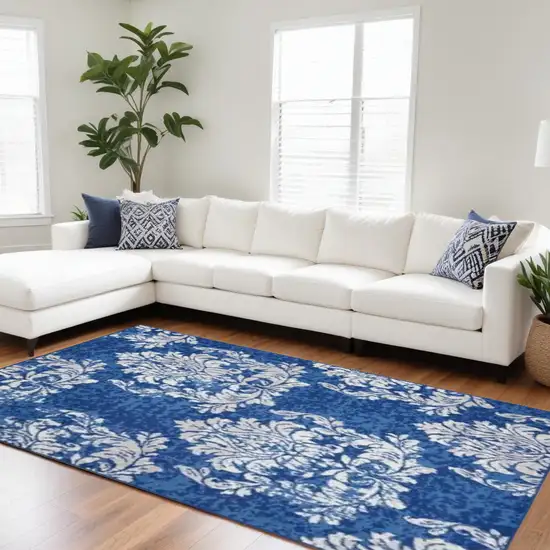 Blue And Ivory Floral Dhurrie Area Rug Photo 1