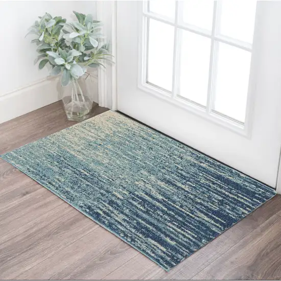 Ivory And Blue Abstract Power Loom Area Rug Photo 1