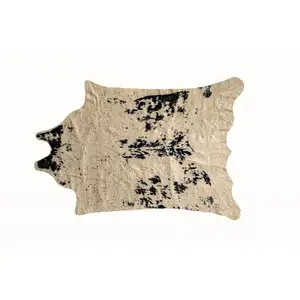 Photo of Off White Black and Gold Faux Cowhide Washable Area Rug