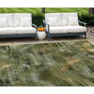 Photo of Olive Green And Gold Abstract Washable Indoor Outdoor Area Rug