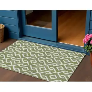 Photo of Olive Green And Ivory Geometric Washable Indoor Outdoor Area Rug