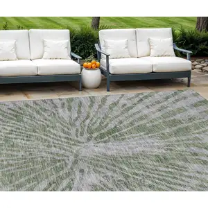 Photo of Olive Green Gray And Silver Abstract Washable Indoor Outdoor Area Rug