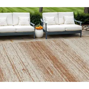 Photo of Orange And Beige Striped Washable Indoor Outdoor Area Rug