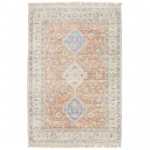 Photo of Orange And Blue Oriental Hand Loomed Stain Resistant Area Rug With Fringe