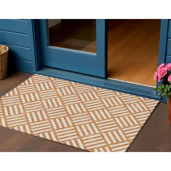 Orange And Ivory Geometric Washable Indoor Outdoor Area Rug Photo 1