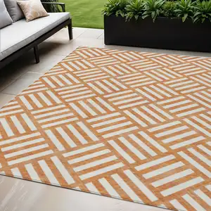 Photo of Orange And Ivory Geometric Washable Indoor Outdoor Area Rug