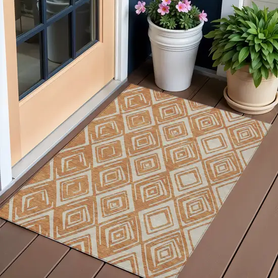 Orange And Ivory Geometric Washable Indoor Outdoor Area Rug Photo 1