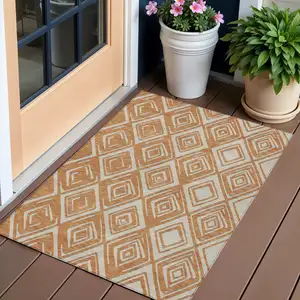 Photo of Orange And Ivory Geometric Washable Indoor Outdoor Area Rug