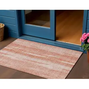 Photo of Orange And Salmon Botanical Leaves Washable Indoor Outdoor Area Rug