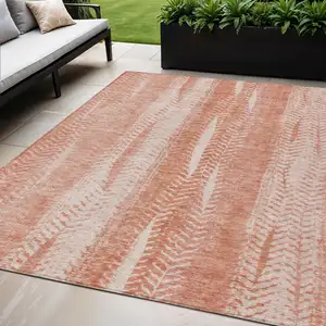 Photo of Orange And Salmon Botanical Leaves Washable Indoor Outdoor Area Rug