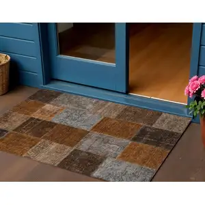 Photo of Orange And Taupe Patchwork Washable Indoor Outdoor Area Rug