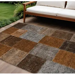 Photo of Orange And Taupe Patchwork Washable Indoor Outdoor Area Rug