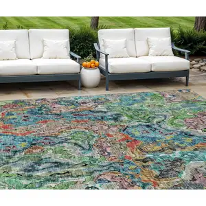 Photo of Orange And Teal Blue Abstract Washable Indoor Outdoor Area Rug