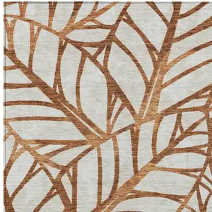 Photo of Orange Beige And Copper Floral Washable Indoor Outdoor Area Rug