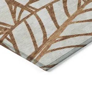 Photo of Orange Beige And Copper Floral Washable Indoor Outdoor Area Rug