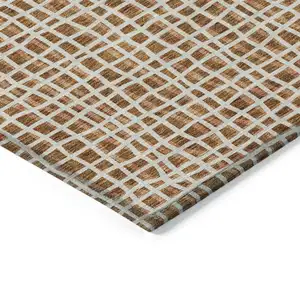 Photo of Orange Beige And Copper Striped Washable Indoor Outdoor Area Rug