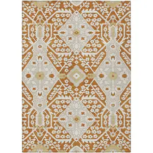 Photo of Orange Beige And Gold Floral Washable Indoor Outdoor Area Rug