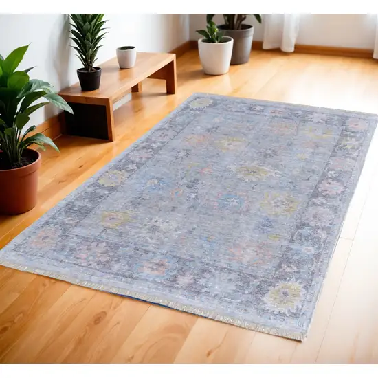 Orange Blue and Gold Floral Hand Woven Distressed Area Rug With Fringe Photo 1