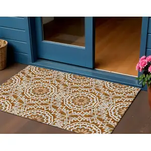 Photo of Orange Copper And Beige Floral Medallion Washable Indoor Outdoor Area Rug