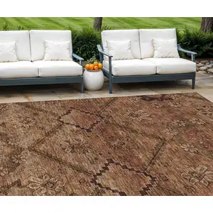 Photo of Orange Copper And Brown Floral Washable Indoor Outdoor Area Rug