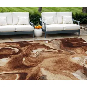 Photo of Orange Copper And Ivory Abstract Washable Indoor Outdoor Area Rug