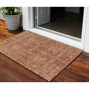 Photo of Orange Copper And Terra Cotta Oriental Washable Indoor Outdoor Area Rug