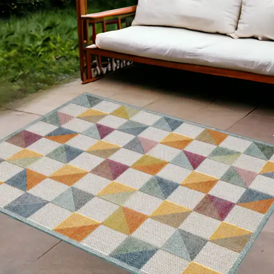 Orange And Ivory Geometric Stain Resistant Indoor Outdoor Area Rug Photo 1