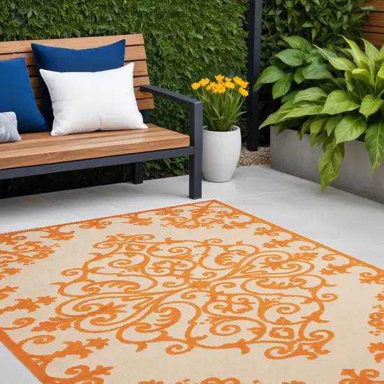 Orange And Ivory Damask Indoor Outdoor Area Rug Photo 1