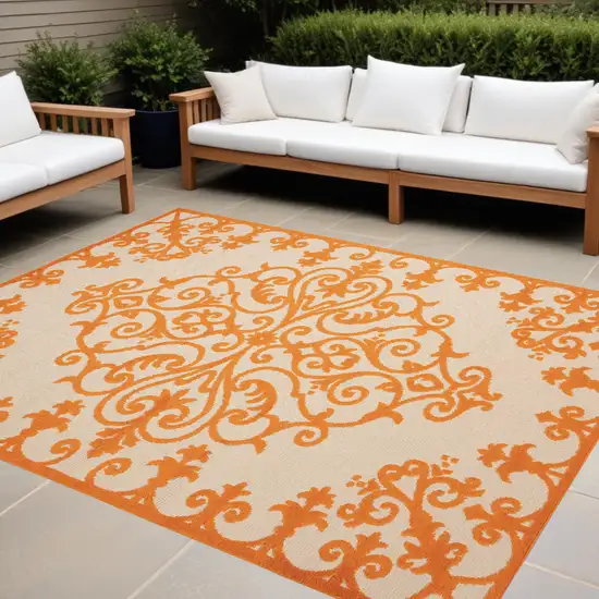 Orange And Ivory Damask Indoor Outdoor Area Rug Photo 1