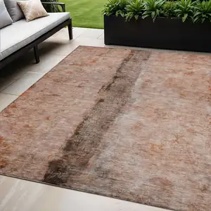 Photo of Orange Peach And Brown Abstract Washable Indoor Outdoor Area Rug