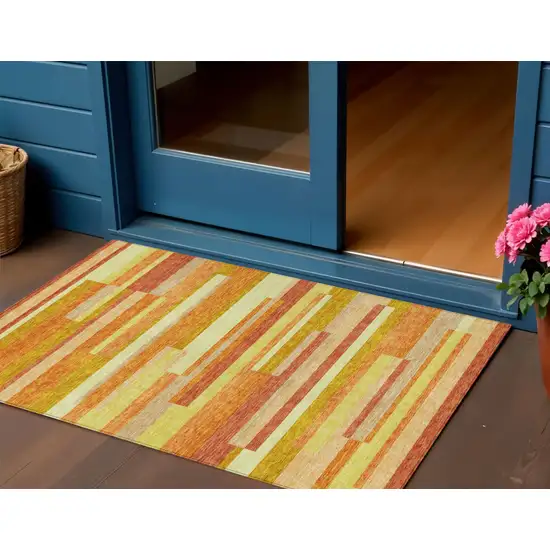 Orange Salmon And Lime Green Striped Washable Indoor Outdoor Area Rug Photo 1