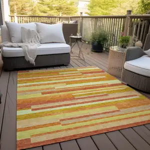 Photo of Orange Salmon And Lime Green Striped Washable Indoor Outdoor Area Rug