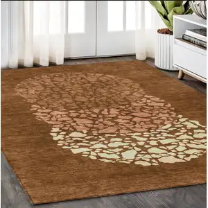 Photo of Orange Terra Cotta And Ivory Abstract Washable Indoor Outdoor Area Rug