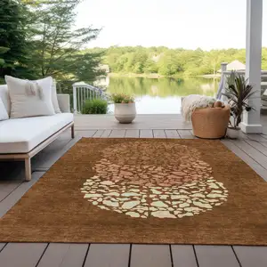 Photo of Orange Terra Cotta And Ivory Abstract Washable Indoor Outdoor Area Rug