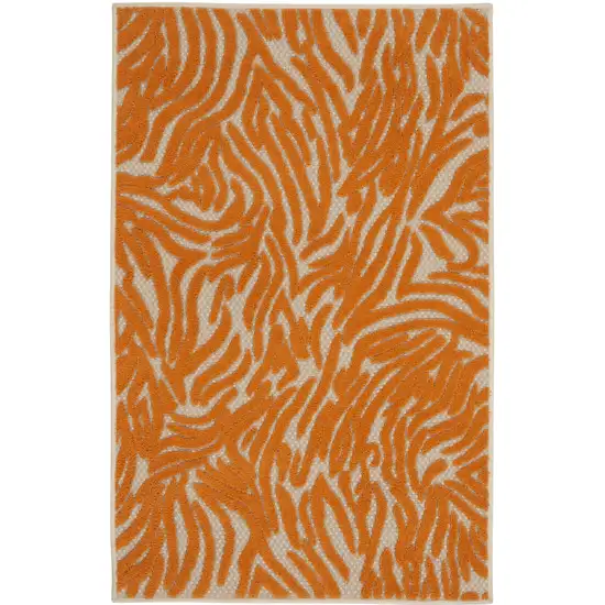 Orange And Ivory Abstract Stain Resistant Indoor Outdoor Area Rug Photo 1