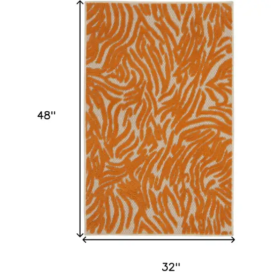 Orange And Ivory Abstract Stain Resistant Indoor Outdoor Area Rug Photo 7