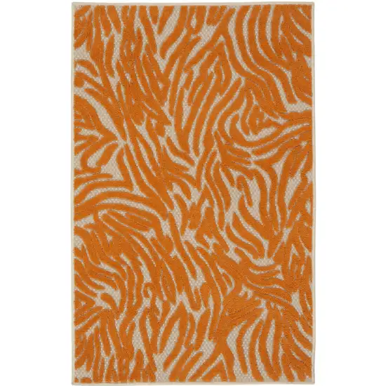 Orange And Ivory Abstract Stain Resistant Indoor Outdoor Area Rug Photo 4