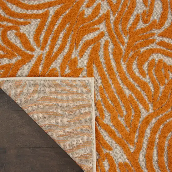 Orange And Ivory Abstract Stain Resistant Indoor Outdoor Area Rug Photo 4