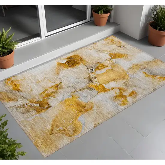 Orange and Ivory Abstract Washable Indoor Outdoor Area Rug Photo 1