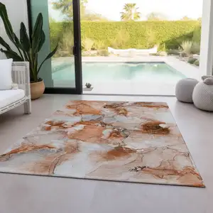 Photo of Orange and Ivory Abstract Washable Non Skid Indoor Outdoor Area Rug