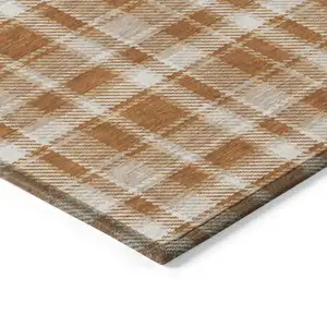 Photo of Orange and Ivory Plaid Washable Non Skid Indoor Outdoor Area Rug