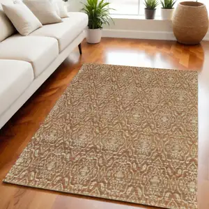 Photo of Orange and Tan Geometric Hand Woven Area Rug