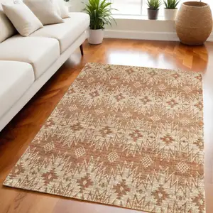 Photo of Orange and Tan Geometric Hand Woven Area Rug